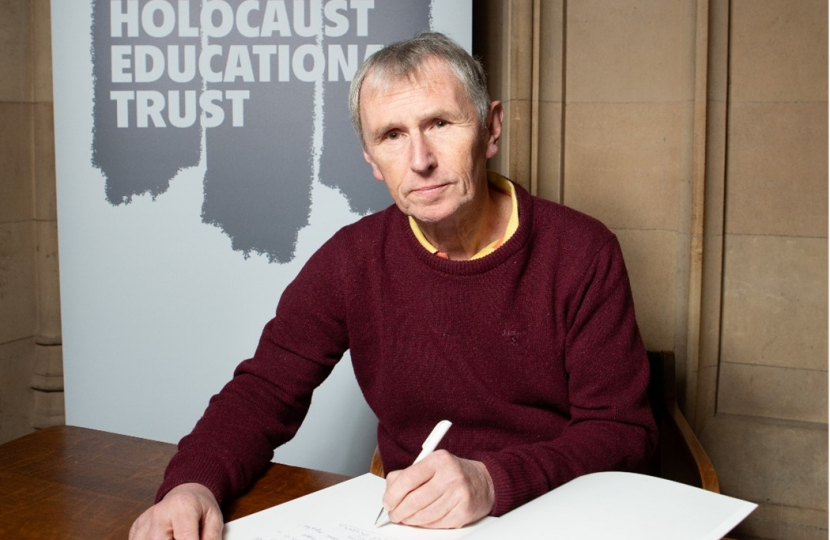 Nigel Evans MP pictured signing the Holocaust Memorial Day Book of Commitment